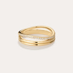 The Noor Pavé Triple Band Ring in Gold features three intertwined bands—one with pavé-set sparkling diamonds and two smooth, polished gold bands for a sophisticated look.