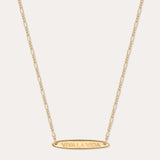 The Viva La Vida Bar Chain Necklace in Gold features an oval horizontal pendant engraved with VIVA LA VIDA on an adjustable delicate figaro chain for the perfect fit.