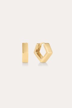 The Judith Hexagon Angular Huggies in Gold are 18k gold plated hoop earrings with a modern, angular design, shown against a light background—one earring is front-facing, the other highlights its side profile and clasp.