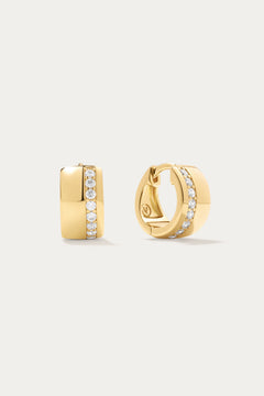 The Juni Pavé Chunky Hoop Earrings in Gold are 18k gold-plated hoops, each accented with a central vertical row of sparkling pavé diamonds, shown against a simple light background.