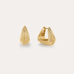 The Juno Ridged Chunky Hoops in Gold feature a modern, shell-inspired design. Displayed on a light background, one hoop stands upright while the other is open to showcase the clasp.