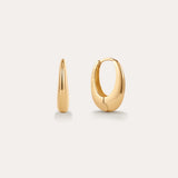 The Lila Medium Round Dome Hoop Earrings in Gold, each 16mm and crafted in 18k yellow gold, are displayed on a plain light background—one showing its sleek side curve, the other highlighting its polished, rounded front.