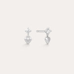The Lilian Crystal Heart Studs Earrings in Silver feature a sparkling star-shaped gemstone above a dangling silver heart charm—perfect dainty earrings for any occasion.