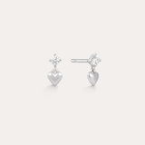 The Lilian Crystal Heart Studs Earrings in Silver feature a sparkling star-shaped gemstone above a dangling silver heart charm—perfect dainty earrings for any occasion.