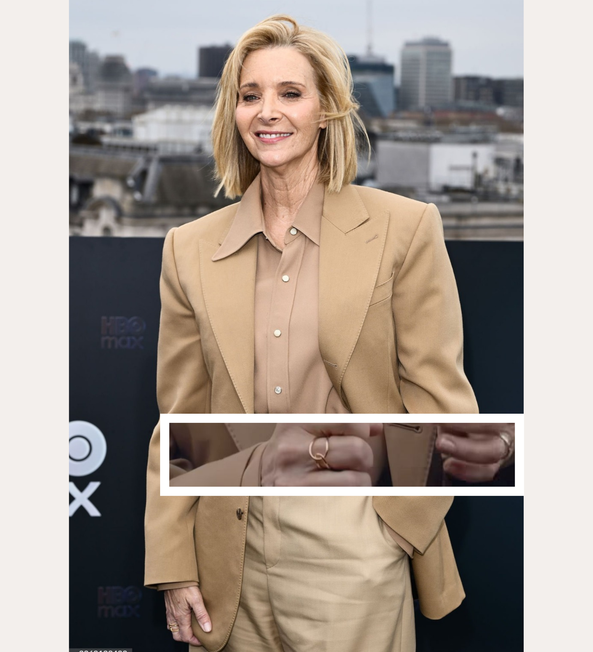 A woman with short blonde hair smiles outdoors in a city, wearing a beige blazer over a matching blouse and the Ayla Link Ring in Gold. Text above reads SPOTTED ON: and below, LISA KUDROW.