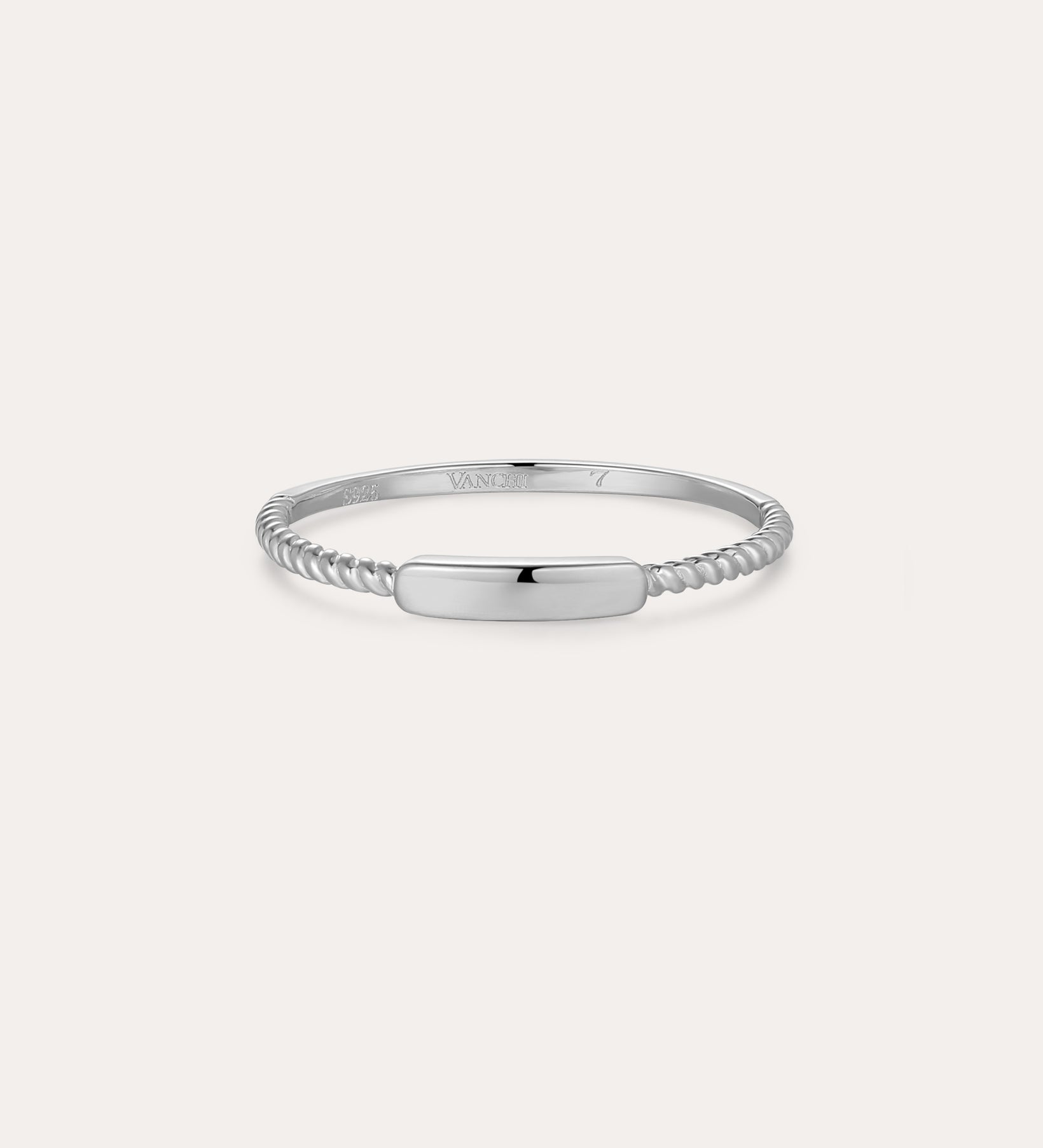 The Lya Horizontal Bar Stacking Ring in Silver features a smooth, polished rectangular center plate and twisted bands on each side—ideal for stacking—and is shown against a plain white background.