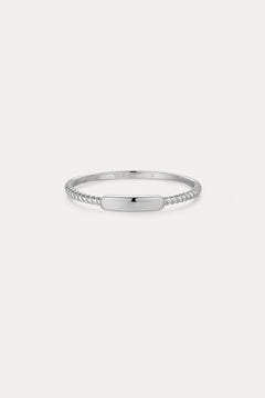 The Lya Horizontal Bar Stacking Ring in Silver features a smooth, polished rectangular center plate and twisted bands on each side—ideal for stacking—and is shown against a plain white background.