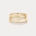 The Nola Pavé Triple Band Ring in Gold features a modern, stacked design with three gold bands, each pavé-set with sparkling diamonds, displayed against a plain light background.