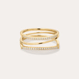 The Nola Pavé Triple Band Ring in Gold features a modern, stacked design with three gold bands, each pavé-set with sparkling diamonds, displayed against a plain light background.