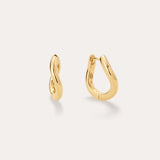 The Nori Twisted Hoop Earrings in Gold, featuring an 18k gold-plated, organically twisted design, are displayed on a plain light background—one shown from the front and one from the side to highlight their fluid curves.