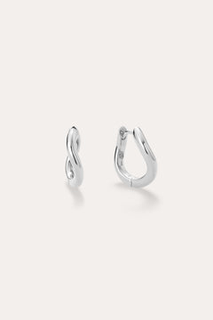 A pair of small, polished Nori Twisted Hoop Earrings in Silver with an infinity-like twist design, displayed on a light background. One sterling silver hoop faces front; the other is sideways to show the clasp.