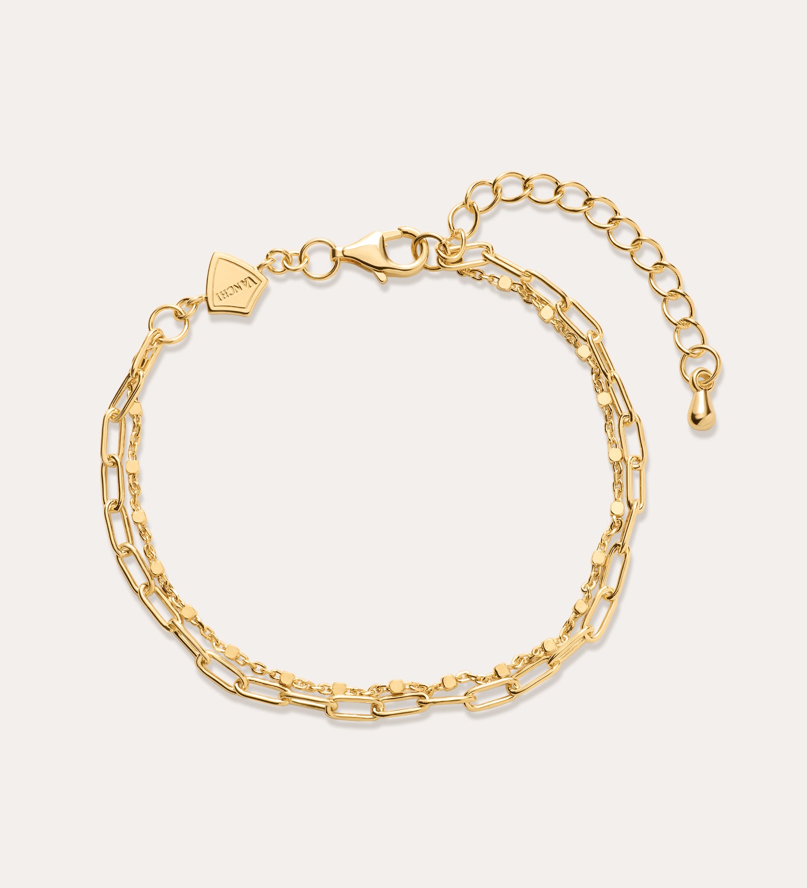 Gold chain bracelet on a white background