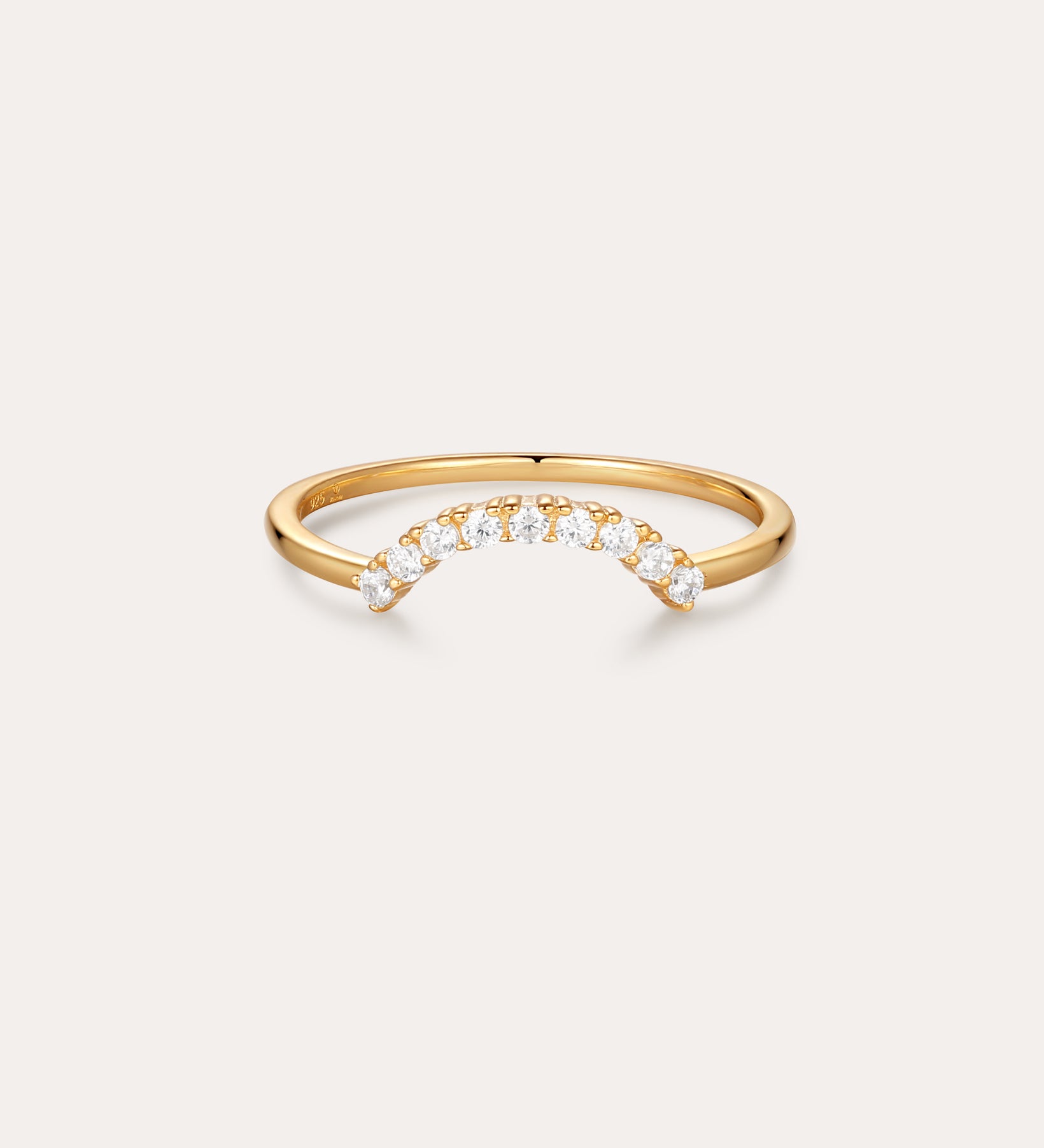 The Reine Rainbow Crystal Ring in Gold features a curved row of small, round crystals set along the top, shown on a simple light background.