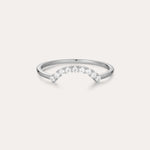 The Reine Rainbow Crystal Ring in Silver is a delicate sterling silver ring with a gentle curve, featuring a row of small, sparkling rainbow crystals set along the curved band. Its thin, minimalist design adds elegant color to any look.
