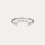 The Reine Rainbow Crystal Ring in Silver is a delicate sterling silver ring with a gentle curve, featuring a row of small, sparkling rainbow crystals set along the curved band. Its thin, minimalist design adds elegant color to any look.