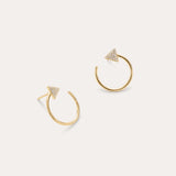 The Reneé Triangle Linear Hoop Stud Earrings in Gold feature a bold triangle design adorned with clear stones, making them the perfect choice for fans of unique gold earrings. Displayed on a simple light background.