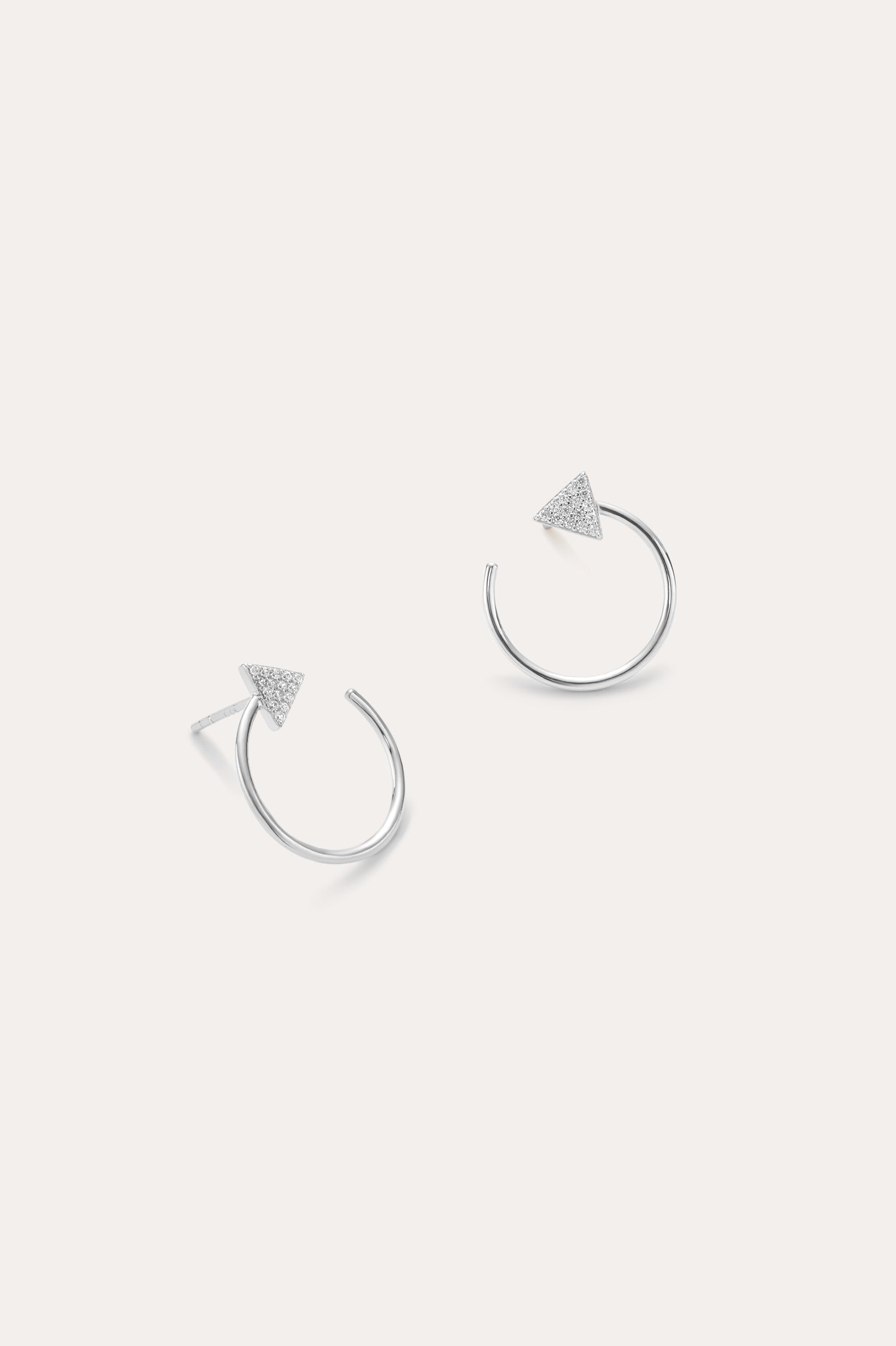 Reneé Triangle Linear Hoop Stud Earrings in Silver feature small textured triangles at the ends of sleek hoops, shown on a plain light background.