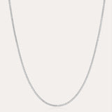 The Alba Tennis Necklace in Silver is displayed against a plain white background, highlighting its delicate and understated elegance.