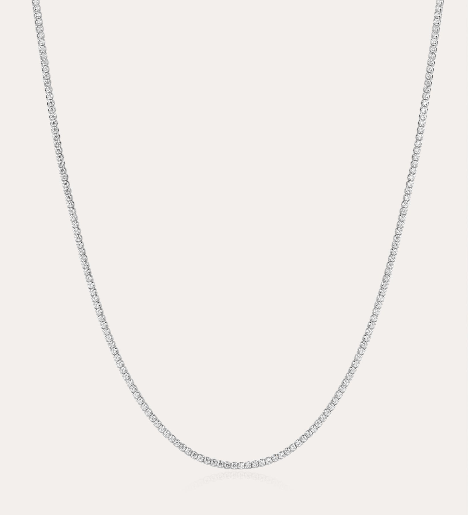 The Alba Tennis Necklace in Silver is displayed against a plain white background, highlighting its delicate and understated elegance.
