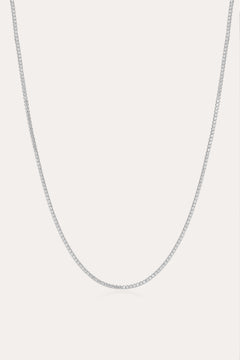 The Alba Tennis Necklace in Silver is displayed against a plain white background, highlighting its delicate and understated elegance.