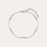 The Bamboo Chain Bracelet in Silver features small, evenly spaced cylindrical accents on a fine S925 sterling silver chain with a lobster clasp and adjustable extension. Displayed against a plain, light background.