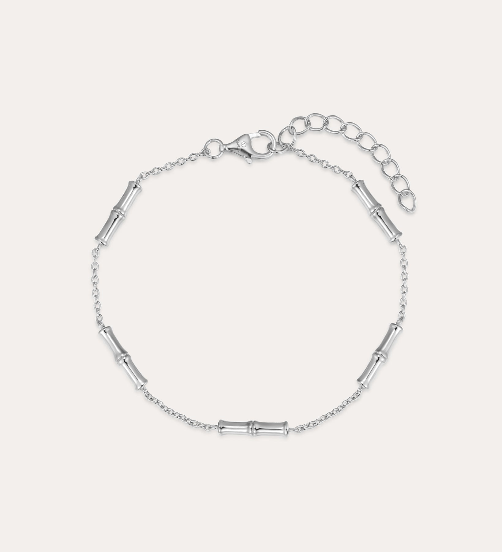 The Bamboo Chain Bracelet in Silver features small, evenly spaced cylindrical accents on a fine S925 sterling silver chain with a lobster clasp and adjustable extension. Displayed against a plain, light background.