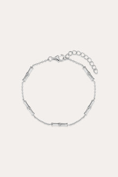 The Bamboo Chain Bracelet in Silver features small, evenly spaced cylindrical accents on a fine S925 sterling silver chain with a lobster clasp and adjustable extension. Displayed against a plain, light background.