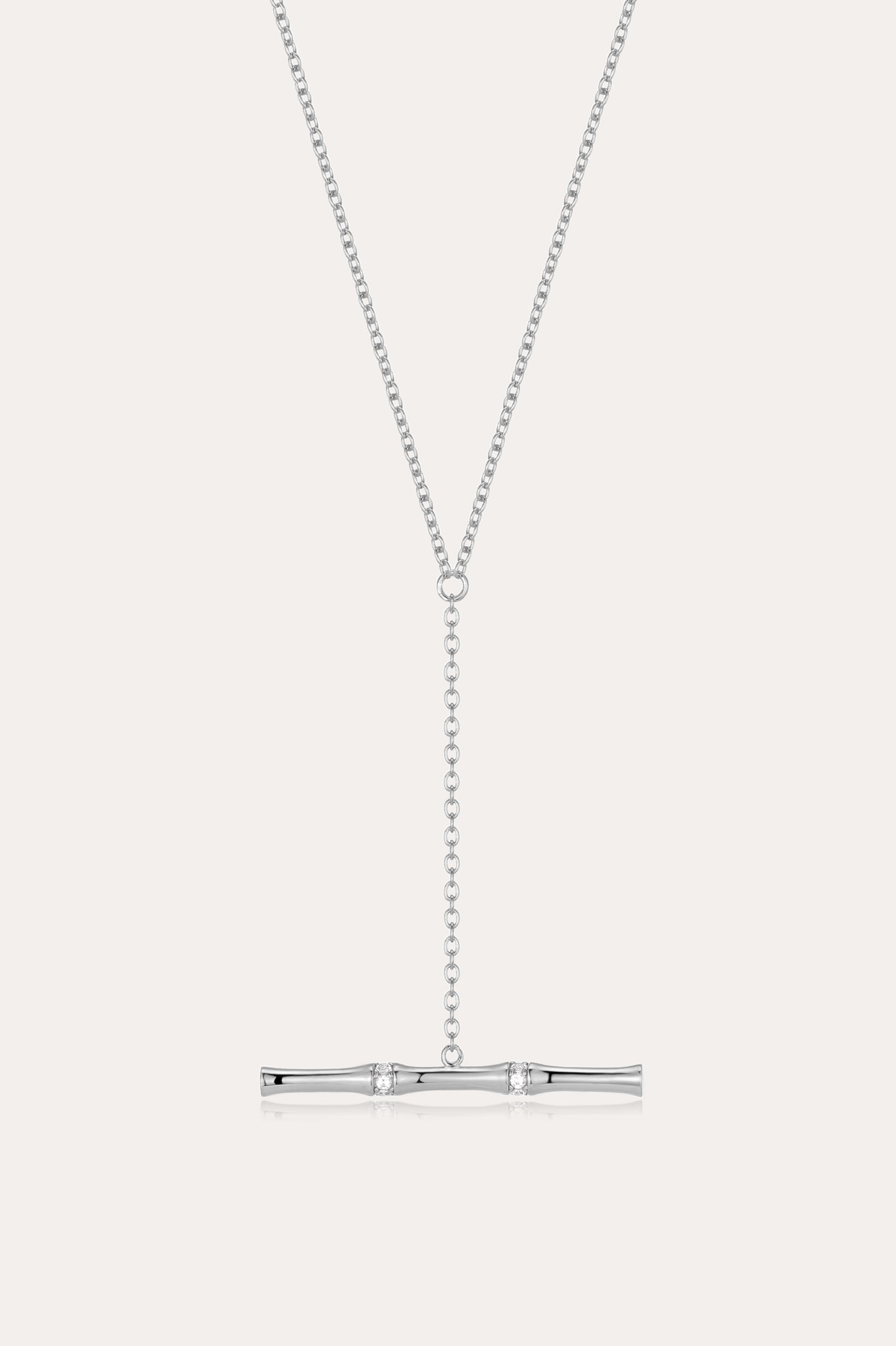 The Bamboo Chain Y-Bar Lariat Necklace in Silver features a delicate vertical chain drop ending with a polished horizontal bar, set against a simple light background.