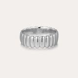 The Charlotte Eternity Ridged Ring in Silver features a rounded, ribbed design around its band and is showcased on a plain light background.