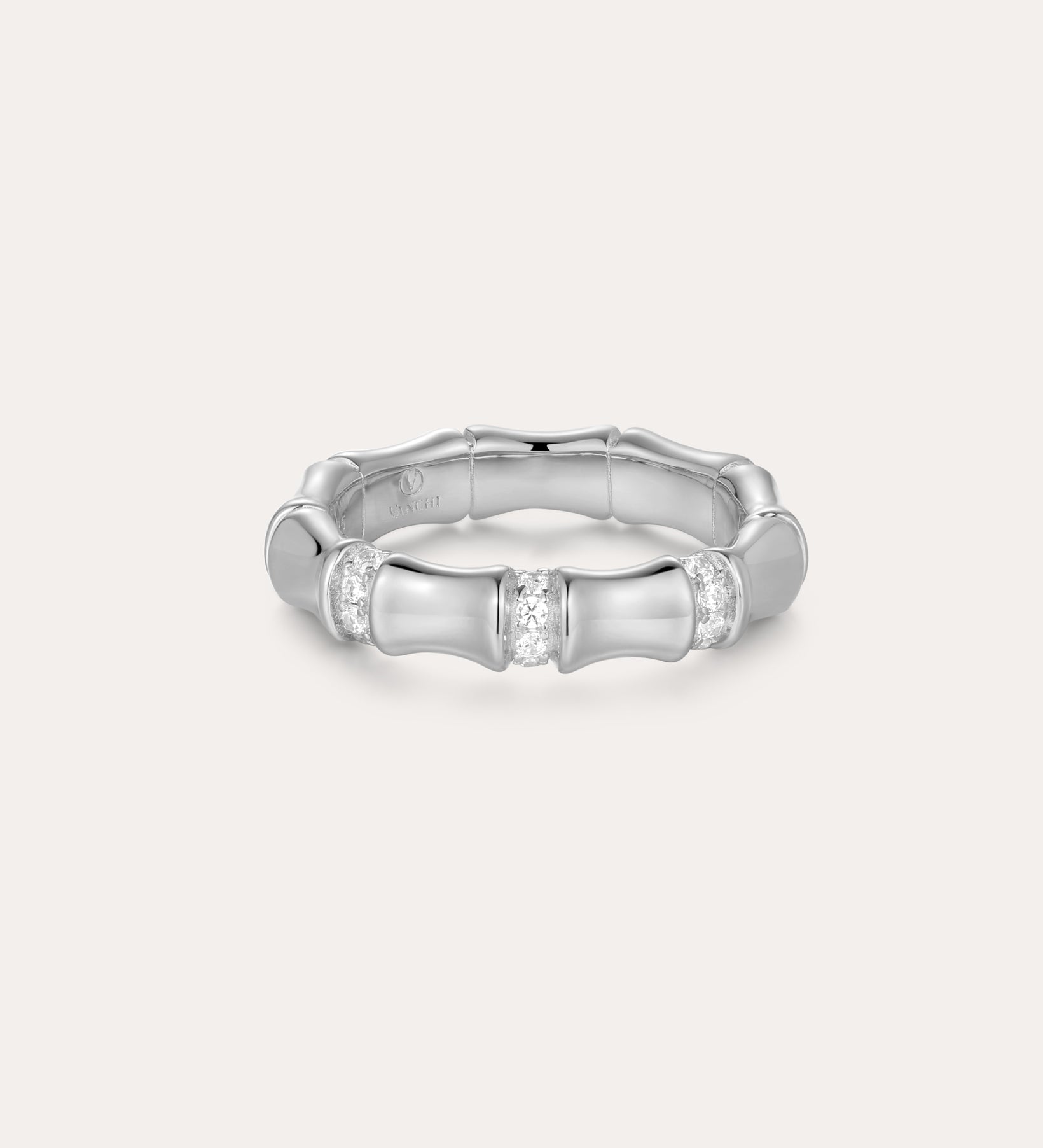The Bamboo Chunky Crystal Ring in Silver is crafted from recycled sterling silver, featuring three sections set with sparkling crystals and a bamboo-inspired design, shown against a plain, light background.