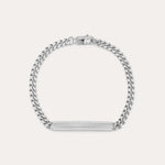 The Gisèle Cuban Link Bar Bracelet in Silver features a sterling silver Cuban link design, a rectangular bar adorned with sparkling cubic zirconia stones, and is finished with a secure lobster clasp.
