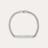 The Gisèle Cuban Link Bar Bracelet in Silver features a sterling silver Cuban link design, a rectangular bar adorned with sparkling cubic zirconia stones, and is finished with a secure lobster clasp.