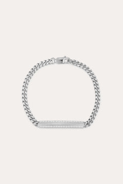 The Gisèle Cuban Link Bar Bracelet in Silver features a sterling silver Cuban link design, a rectangular bar adorned with sparkling cubic zirconia stones, and is finished with a secure lobster clasp.