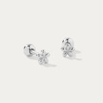 The Fleur Flower Barbell Stud Piercing in Silver features petite, cherry blossom-shaped studs, elegantly displayed on a plain white background.