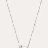 Silver necklace with a curved pendant on a light gray background