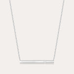 The Regina Horizontal Bar Pendant Necklace in Silver features a minimalist silver bar with a single, sparkling cubic zirconia at its center—ideal for lovers of simple, elegant jewelry.