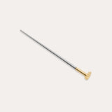 The Vanchi Labret Piercing Taper Care Set features a long, slender metal taper with a gold-toned circular end, displayed diagonally on a plain white background.