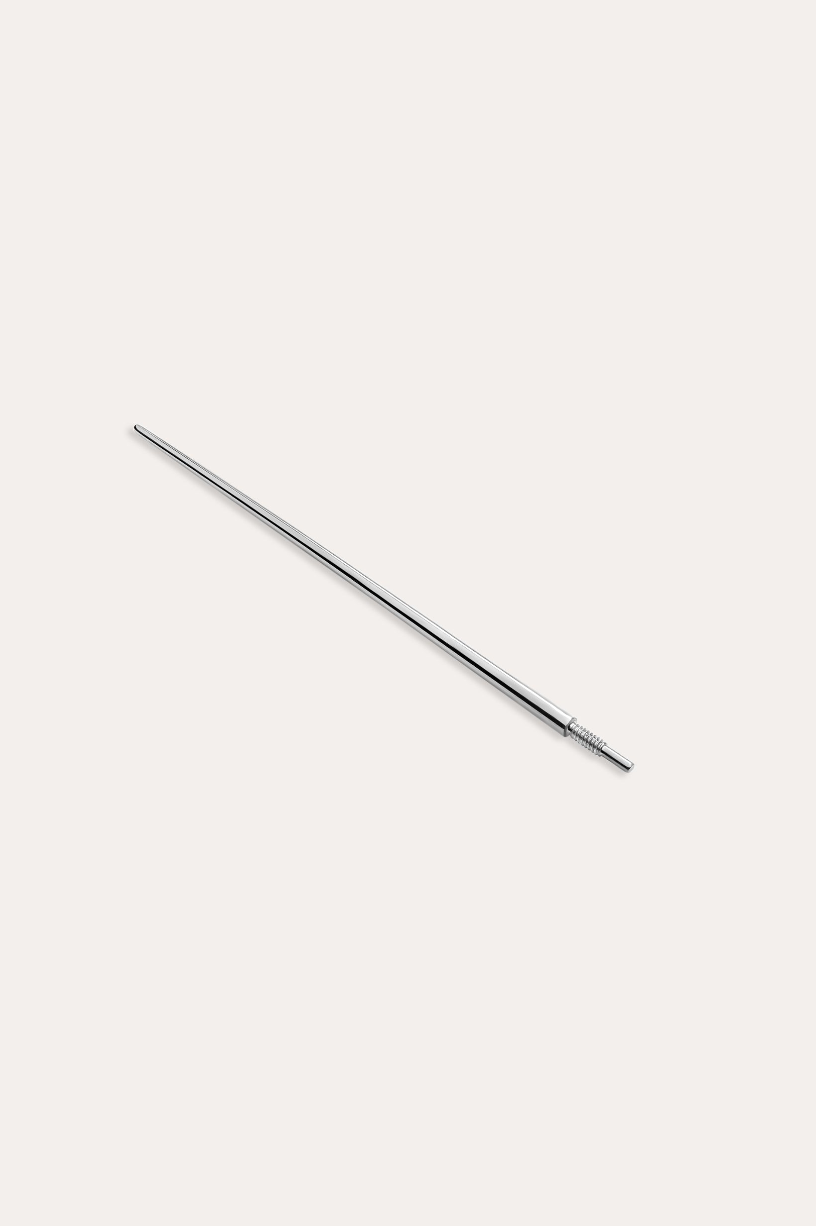 The Vanchi Labret Piercing Taper Care Set features a slender, silver metal tool with a pointed tip and textured grip, displayed against a plain white background.