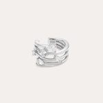The Vale Crystal Ear Cuff in Silver features three parallel bands accented with five clear, uniquely shaped gemstones, shown against a light background.