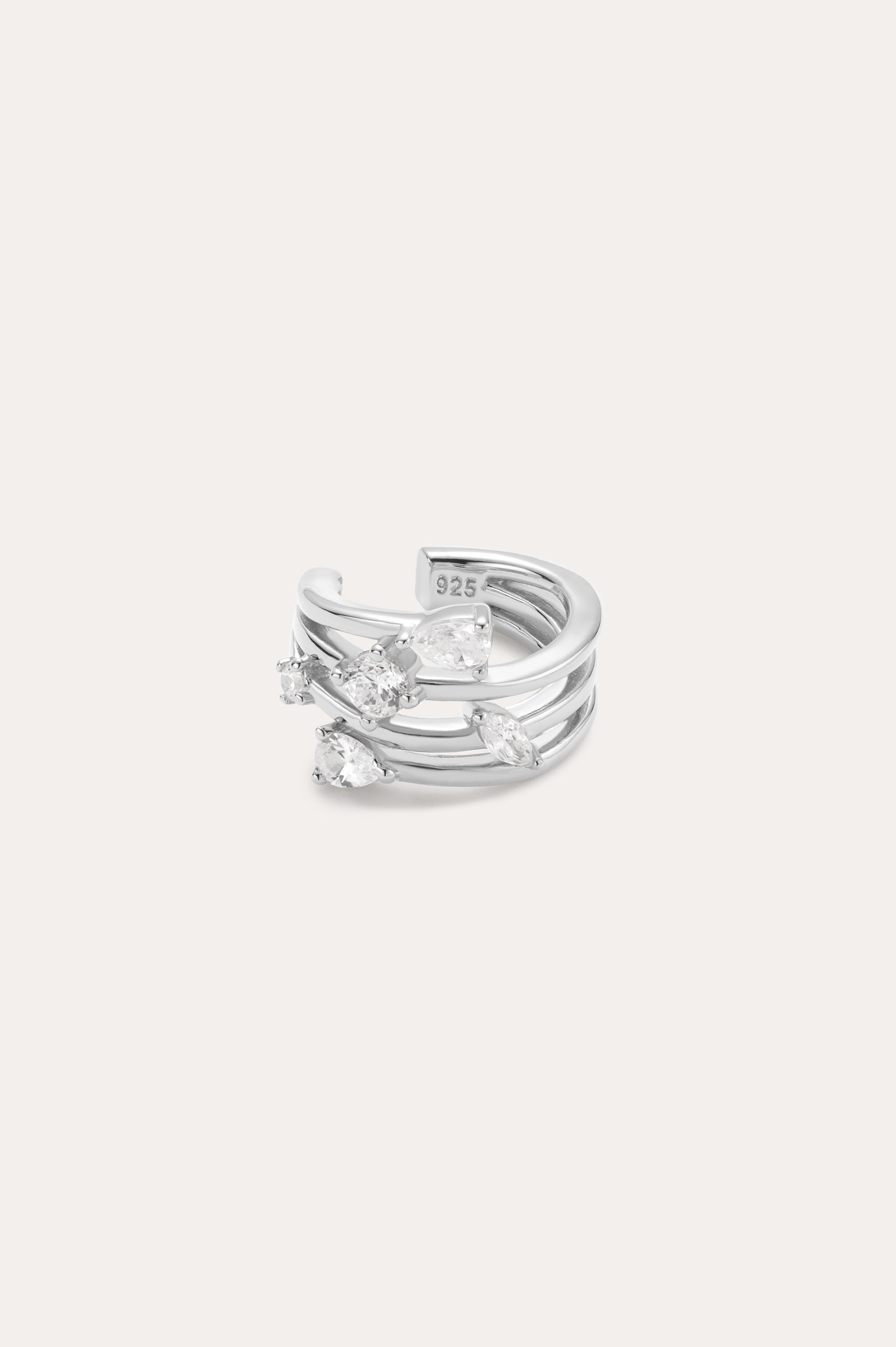 The Vale Crystal Ear Cuff in Silver features three parallel bands accented with five clear, uniquely shaped gemstones, shown against a light background.
