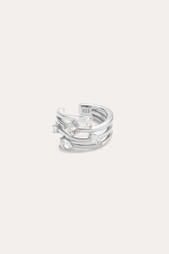 The Vale Crystal Ear Cuff in Silver features three parallel bands accented with five clear, uniquely shaped gemstones, shown against a light background.