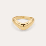 The Vava Plain Chunky Curved Wave Ring in Gold features a smooth, polished gold-plated finish with a minimalist, curved and slightly pointed front, showcased on a simple light background.