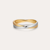 The Yvette Two-Tone Mixed Metal Ring features intertwined bands of gold and silver, showcased against a plain, light background.