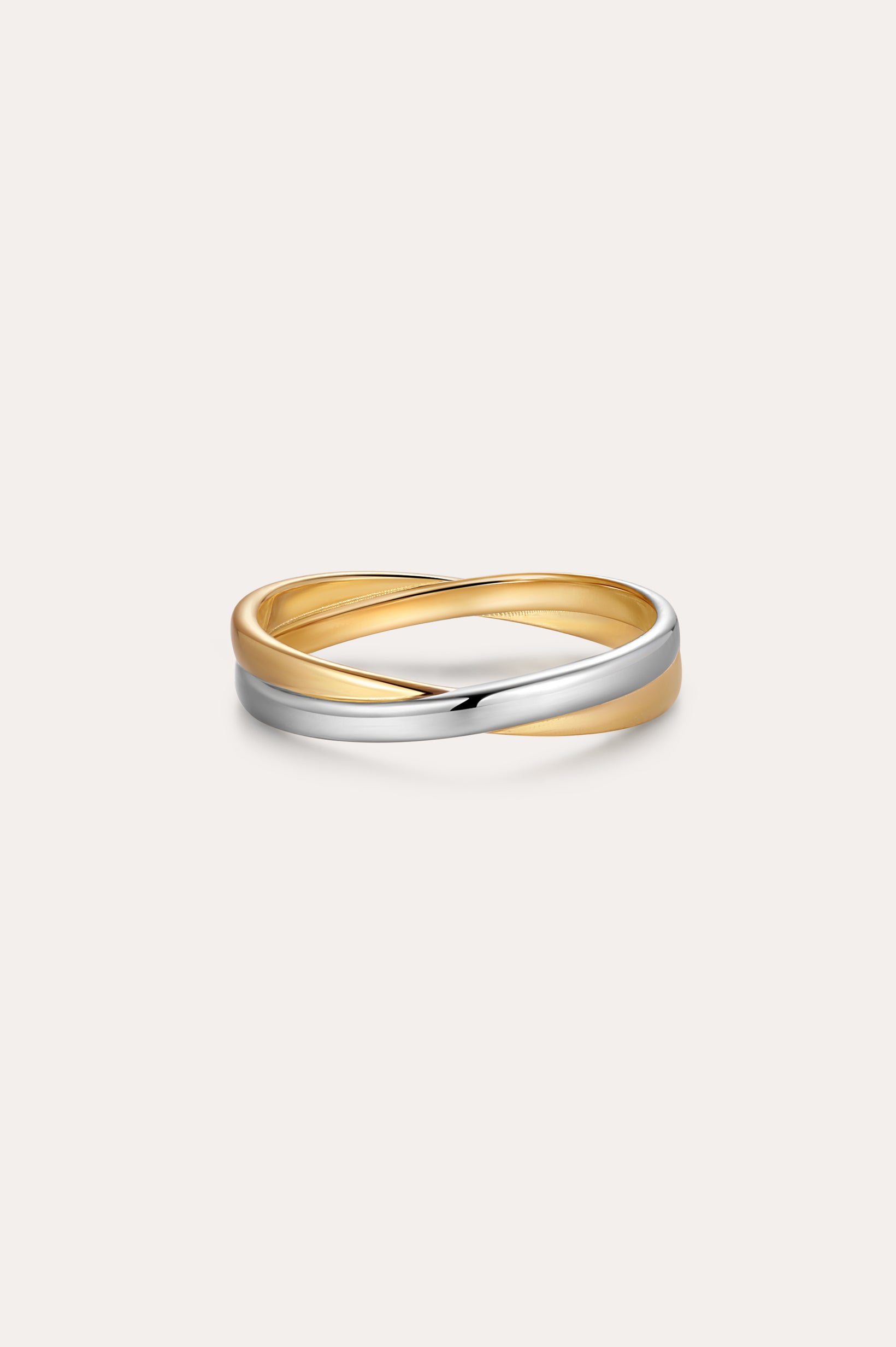 The Yvette Two-Tone Mixed Metal Ring features intertwined bands of gold and silver, showcased against a plain, light background.