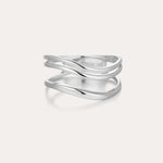 The Zoe Triple Wave Ring in Silver is a minimalist piece made from recycled sterling silver, featuring three polished, overlapping bands and shown against a plain light background.
